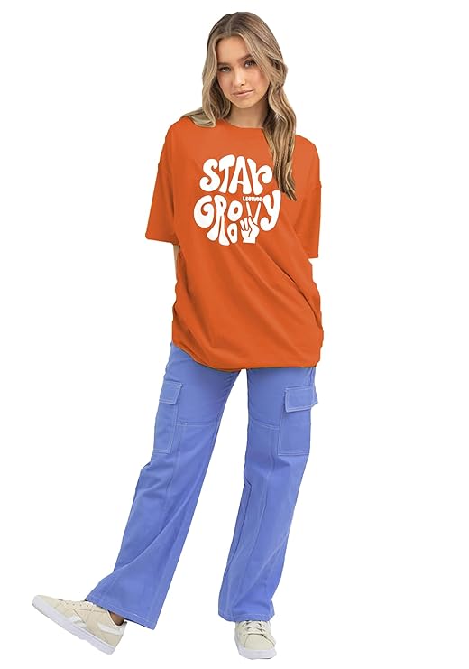 Stay Groovy Typography Printed Drop Shoulder Oversized T-Shirt for Women (Orange) – Trendy Half Sleeve Tee with Classic Round Neck, Soft & Breathable Cotton Blend Fabric for Comfort & Durability. Perfect for a Casual, Comfy, and Stylish Look!