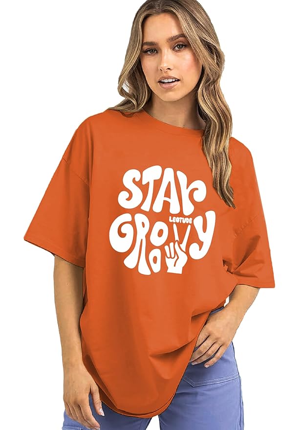 Stay Groovy Typography Printed Drop Shoulder Oversized T-Shirt for Women (Orange) – Trendy Half Sleeve Tee with Classic Round Neck, Soft & Breathable Cotton Blend Fabric for Comfort & Durability. Perfect for a Casual, Comfy, and Stylish Look!