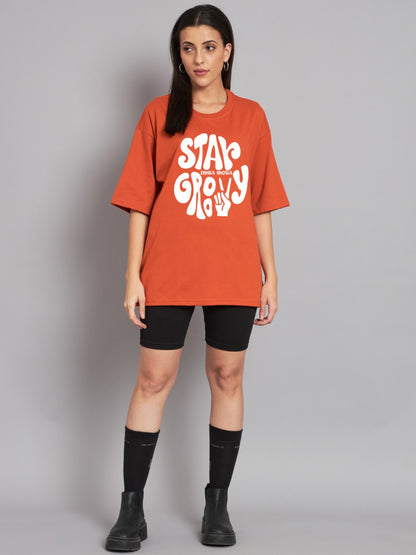 Stay Groovy Typography Printed Drop Shoulder Oversized T-Shirt for Women (Orange) – Trendy Half Sleeve Tee with Classic Round Neck, Soft & Breathable Cotton Blend Fabric for Comfort & Durability. Perfect for a Casual, Comfy, and Stylish Look!