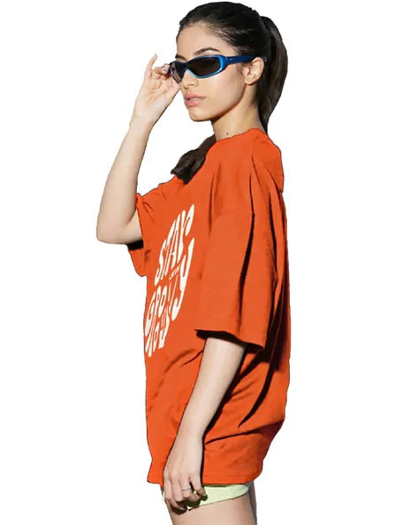 Stay Groovy Typography Printed Drop Shoulder Oversized T-Shirt for Women (Orange) – Trendy Half Sleeve Tee with Classic Round Neck, Soft & Breathable Cotton Blend Fabric for Comfort & Durability. Perfect for a Casual, Comfy, and Stylish Look!