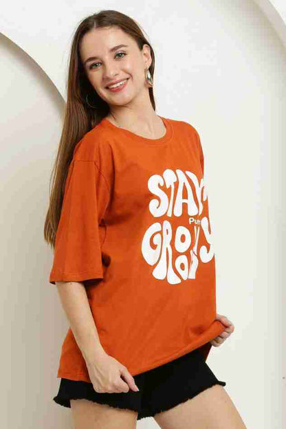 Stay Groovy Typography Printed Drop Shoulder Oversized T-Shirt for Women (Orange) – Trendy Half Sleeve Tee with Classic Round Neck, Soft & Breathable Cotton Blend Fabric for Comfort & Durability. Perfect for a Casual, Comfy, and Stylish Look!