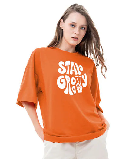 Stay Groovy Typography Printed Drop Shoulder Oversized T-Shirt for Women (Orange) – Trendy Half Sleeve Tee with Classic Round Neck, Soft & Breathable Cotton Blend Fabric for Comfort & Durability. Perfect for a Casual, Comfy, and Stylish Look!
