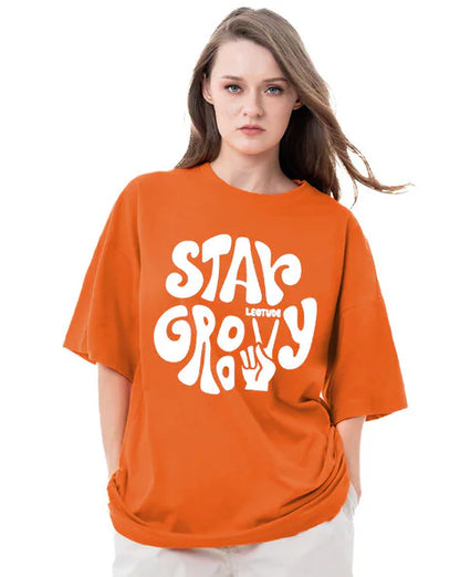 Stay Groovy Typography Printed Drop Shoulder Oversized T-Shirt for Women (Orange) – Trendy Half Sleeve Tee with Classic Round Neck, Soft & Breathable Cotton Blend Fabric for Comfort & Durability. Perfect for a Casual, Comfy, and Stylish Look!